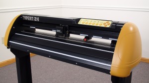 the GCC expert 24 vinyl cutter in black and yellow