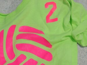 neon green tee-shirt with hot pink design in both screen print and heat-transfer vinyl